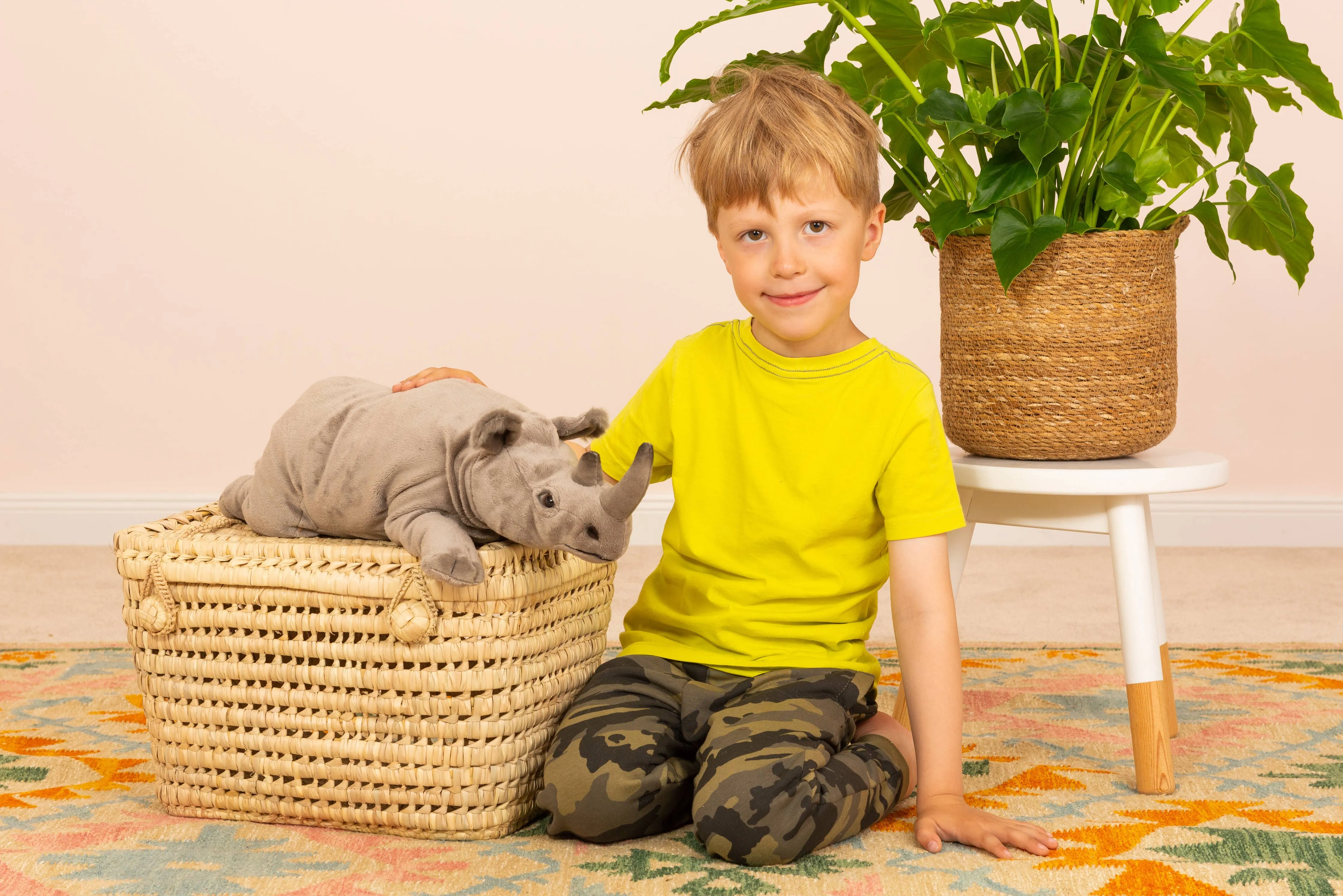 Lifelike Rhinoceros Lying 45 cm - plush toy by Teddy Hermann